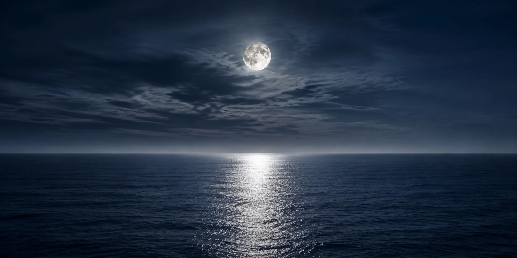 Moonlight stretching across an indigo sea